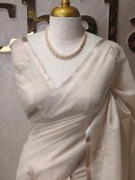 Tissue silk with floral vien like applique-embroidery on the pallu and minimal floral motifs allover the body. - Image 2