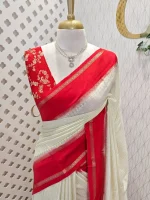 Viscose with contrast border and small zari check on the body with contrast zari woven blouse.