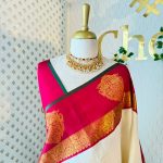 Kanjeevaram saree with a plain body, contrast border and grand peacock zari woven motif on the border