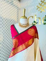 Kanjeevaram saree with a plain body, contrast border and grand peacock zari woven motif on the border