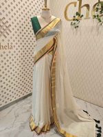 Mul cotton saree with a plain body,complemented by a broad zari border with contrast edging and tassel detailing - Image 3