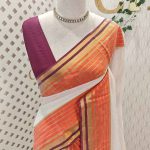 Mul cotton saree with plain body, complimented by a contrast striped zari border