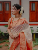 Organza banarasi with leafy-inspired zari-woven buttas all over the body and a rich traditional contrast border - Image 2
