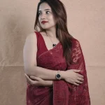 Organza saree with an allover paisley-inspired thread work pattern highlighted by intricate floral detailing