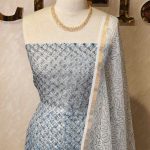 Net kota salwar material with floral print pattern allover the body and a floral printed border