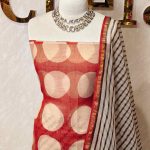 Net kota salwar material with oversized polka dot printed patterns across the body