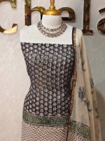Net Kota salwar material with a central zigzag printed pattern,ethnic butta prints on both sides,and paisley-inspired panels