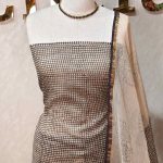 Net kota salwar material with small polka dot printed patterns all over the body and a floral bud printed border
