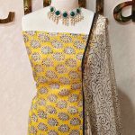 Net Kota salwar material with paisley-inspired printed patterns across the body and a contrast floral printed border