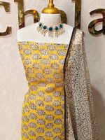 Net Kota salwar material with paisley-inspired printed patterns across the body and a contrast floral printed border