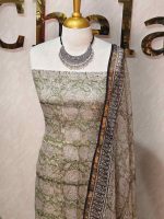 Net kota salwar material with an all-over paisley and floral patterns