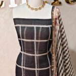 Net kota salwar material with oversized windowpane check prints across the body in a bold contemporary design