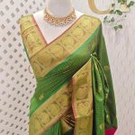 Soft silk with traditional zari woven buttas on the body and a contrast paisley zari-woven border