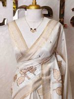 Semi Tussar with oversized floral applique-embroidery on the lower body and minimal floral buttas all-over the body