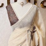 Tissue saree with oversized floral-vine inspired applique detailing on the body and a delicate crochet lace border