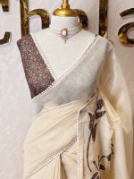 Tissue saree with oversized floral-vine inspired applique detailing on the body and a delicate crochet lace border