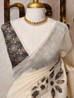 Tissue Saree with floral applique embroidery on the body complimented by a lace-detailing  border - Image 2