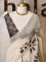 Tissue Saree with floral applique embroidery on the body complimented by a lace-detailing  border