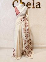 Tissue Saree with floral applique embroidery on the body complimented by a lace-detailing  border - Image 6