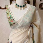 Tissue saree with orchid -inspired floral applique-embroidery on the lower body complimented by a lace-detailing  border