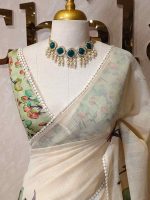 Tissue saree with orchid -inspired floral applique-embroidery on the lower body complimented by a lace-detailing  border - Image 2