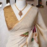 Tissue saree with oversized lotus-inspired floral prints gracefully spread across the body