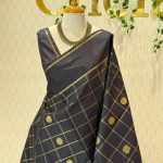 Kanjeevaram saree with a plain body, highlighted by a large zari-woven check pattern and elegant peacock  zari-woven motifs