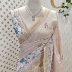 Linen saree with scattered floral buttas, floral vine pallu, and lace-inspired border