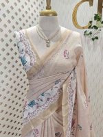 Linen saree with scattered floral buttas, floral vine pallu, and lace-inspired border