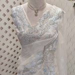 Organza saree with leafy embroidery and intricate lace border