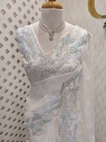 Organza saree with leafy embroidery and intricate lace border