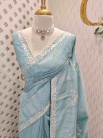 Semi Tussar Saree with floral embroidery, zari-patterned body, and minimal floral vine border