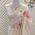 Kerala saree with large hibiscus print all over the body and pallu