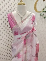 Georgette saree with scattered floral motifs on body decorated with sticky stones and scalloped boarder - Image 13