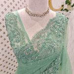 Net with floral beadwork and sequin-embellished scalloped border