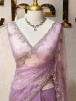 Net saree with heavy border and floral-vein Aari work body