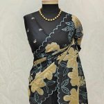 Organza with oversized floral applique and leafy vine embroidery.