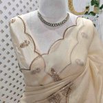 Organza with sequence leaf embroidery and scalloped zari border detailing