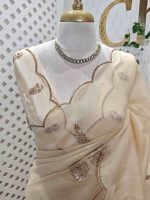 Organza with sequence leaf embroidery and scalloped zari border detailing