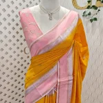 Viscose with contrast border and small zari checks and buttas on the body