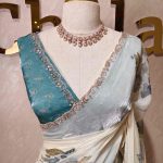 Georgette saree with simple print along with single stone work and beads worked scalloped boarder