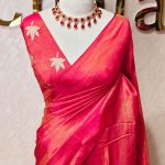Tissue silk saree with plain body and elegant leaf motifs blouse
