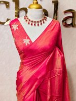 Tissue silk saree with plain body and elegant leaf motifs blouse