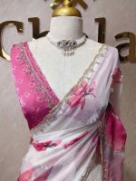 Georgette saree with scattered floral motifs on body decorated with sticky stones and scalloped boarder - Image 2