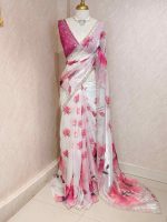 Georgette saree with scattered floral motifs on body decorated with sticky stones and scalloped boarder - Image 3