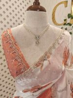 Georgette saree with scattered floral motifs on body decorated with sticky stones and scalloped boarder - Image 11