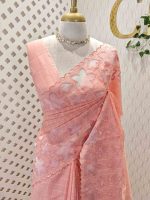 Net kota with grid pattern on body part and boarder with floral shaped applique work and scallop