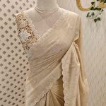 Semi Tussur saree with small motif all over the body and cut work on pallu along with scallop