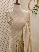 Semi Tussur saree with small motif all over the body and cut work on pallu along with scallop